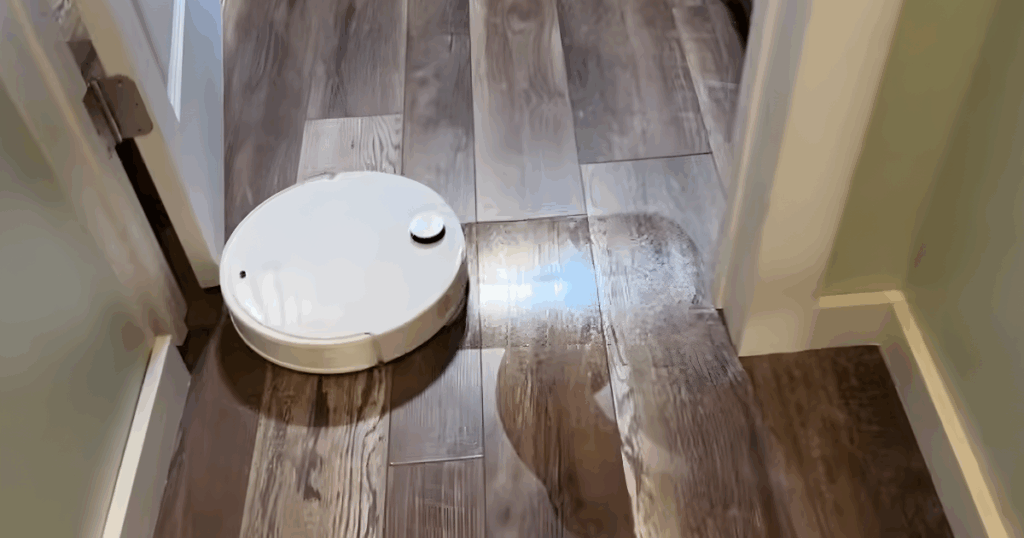 Roborock Qrevo CurvX robot vacuum mop cleaning dark hardwood floor with a wet pass but without the visible streaking we expected after multiple runs
