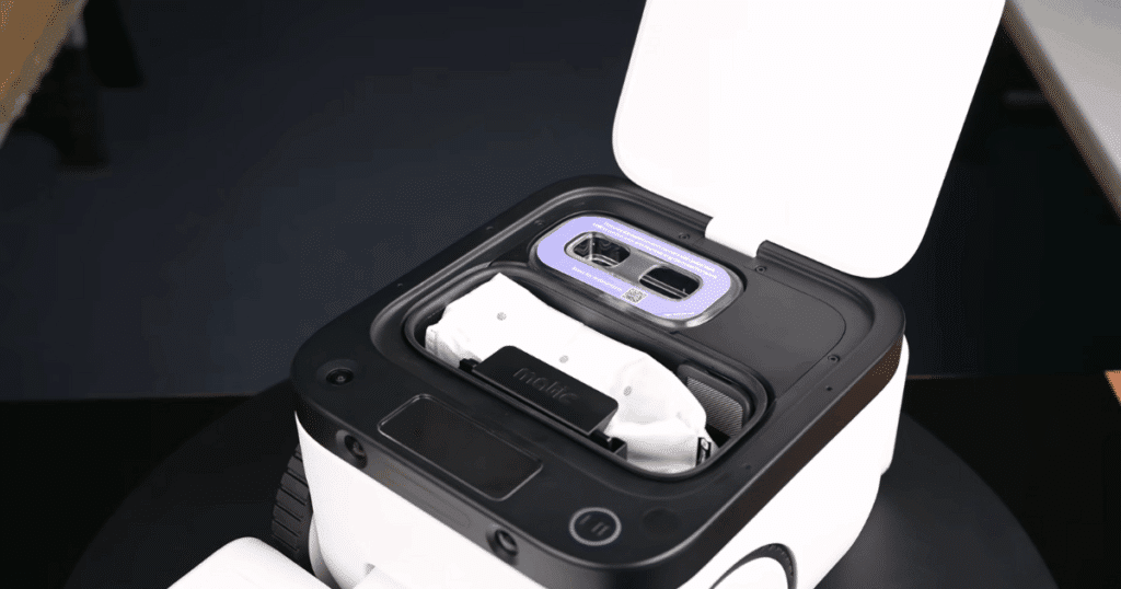 Matic onboard dustbin | Vacuum Wars Interior of the Matic robot vacuum showing its disposable onboard dust bag, providing a 1,000 ml dustbin capacity compared to the 400 ml average.