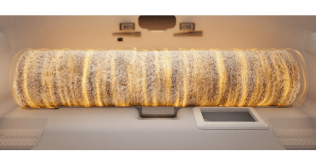 Roborock Qrevo Curv 2 mop clean | Vacuum Wars Illustration of Roborock Qrevo Curv 2 Flow roller mop inside the dock’s cleaning tray, showing the separated clean and dirty water system that prevents cross-contamination and keeps the mop refreshed for each cleaning session