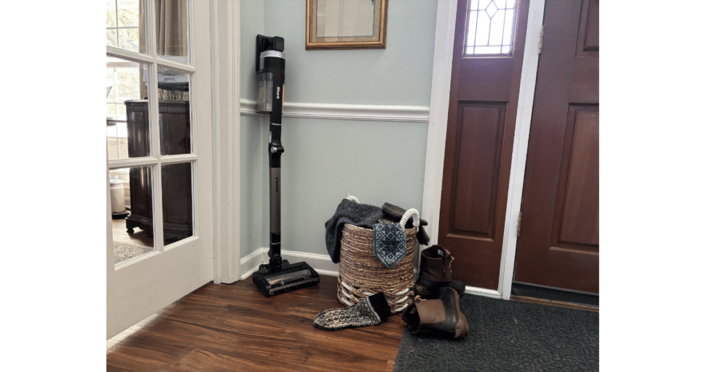 Cordless Vacuum by the front door 1 | Vacuum Wars Cordless stick vacuum stored near an entryway for quick cleanup during winter storm conditions.