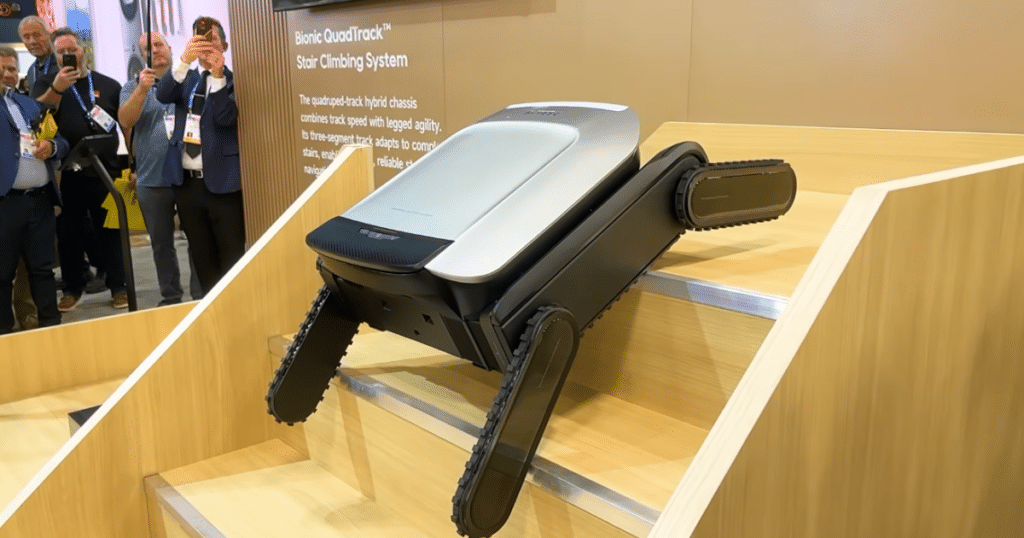 Dreame CyberX at CES 2026 | Vacuum Wars Dreame robot vacuum prototype demonstrating the Cyber X adaptive stair-climbing module on a stepped display at CES.