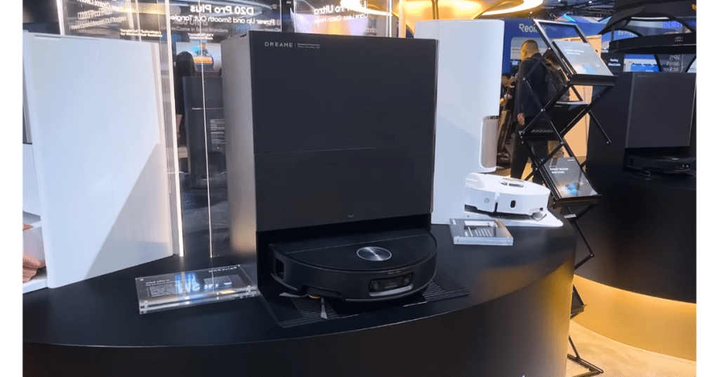Dreame X60 Ultra at CES 2026 | Vacuum Wars Dreame X60 Ultra robot vacuum displayed with its docking station at a CES exhibit.