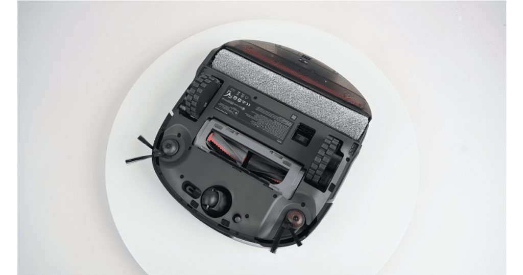 Eufy Omni S2 Robot Vacuum Mop Roller Brush at Vacuum Wars | Vacuum Wars Underside of the Eufy Omni S2 robot vacuum showing the HyperStream 2.0 roller mop, wheels, side brushes, and cleaning components.