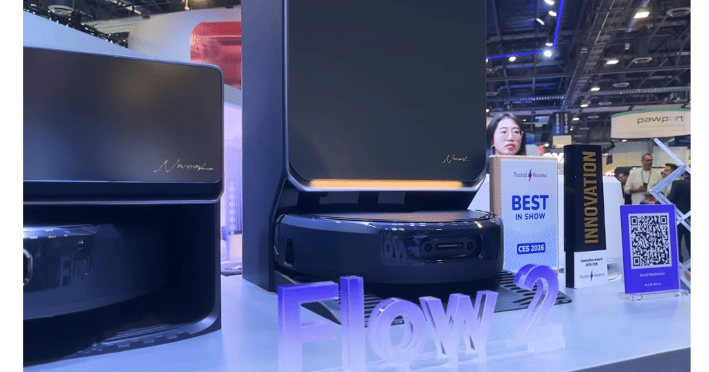 Narwal Flow 2 Robot Vacuum at CES 2026 | Vacuum Wars Narwal Flow 2 robot vacuum and docking station displayed at a CES 2026 exhibit with award signage.