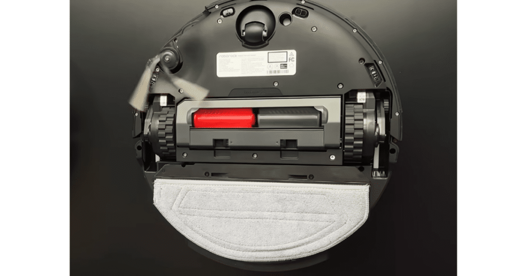 Roborock Saros 20 Sonic VibaRise at CES 2026 | Vacuum Wars Underside of the Roborock Saros 20 Sonic robot vacuum showing its brush assembly and vibrating mop pad.