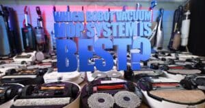 A table full of robot vacuums and mop components with large text over the image reading, “Which Robot Vacuum Mop System Is Best?” — Our best robot vacuum mop comparison.
