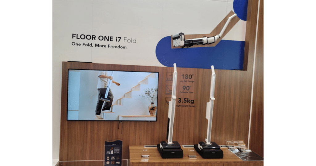 Tineco Floor ONE i7 Fold hard floor cleaner at CES 2026 | Vacuum Wars Tineco Floor ONE i7 Fold on display at CES 2026 showing its 180-degree foldable tube and lay-flat hard floor cleaner design
