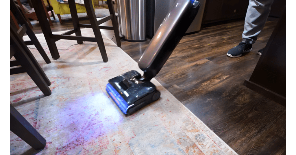 Tineco Floor One S9 Artist Steam carpet | Vacuum Wars Tineco Floor One S9 Artist Steam vacuum mop combo cleaning a rug edge while mopping and picking up dry debris