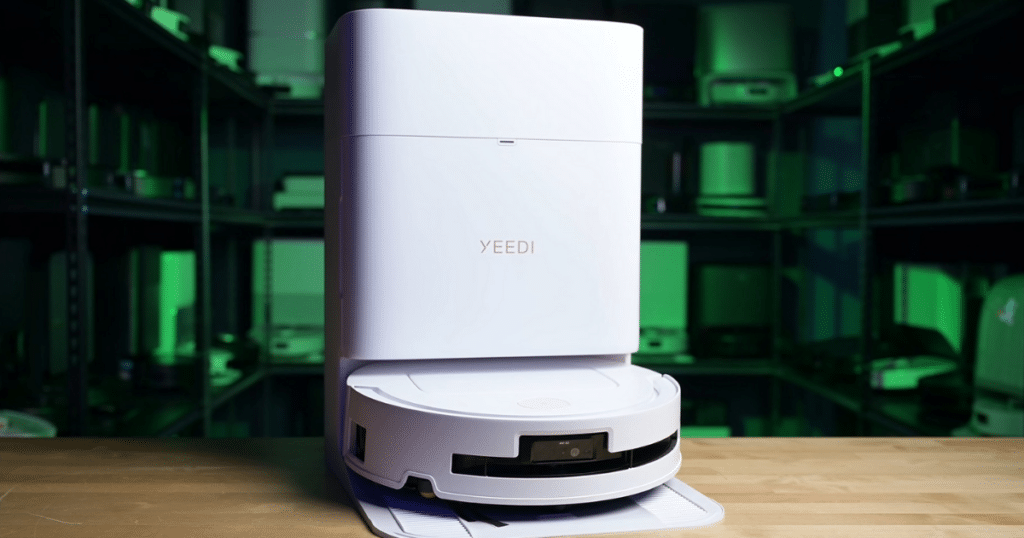 Yeedi M14 Plus Robot Vacuum and Mop at the Vacuum Wars Studio | Vacuum Wars Yeedi M14+ robot vacuum docked at its Omni-Station, which automates dustbin emptying, mop washing, drying, and water management.
