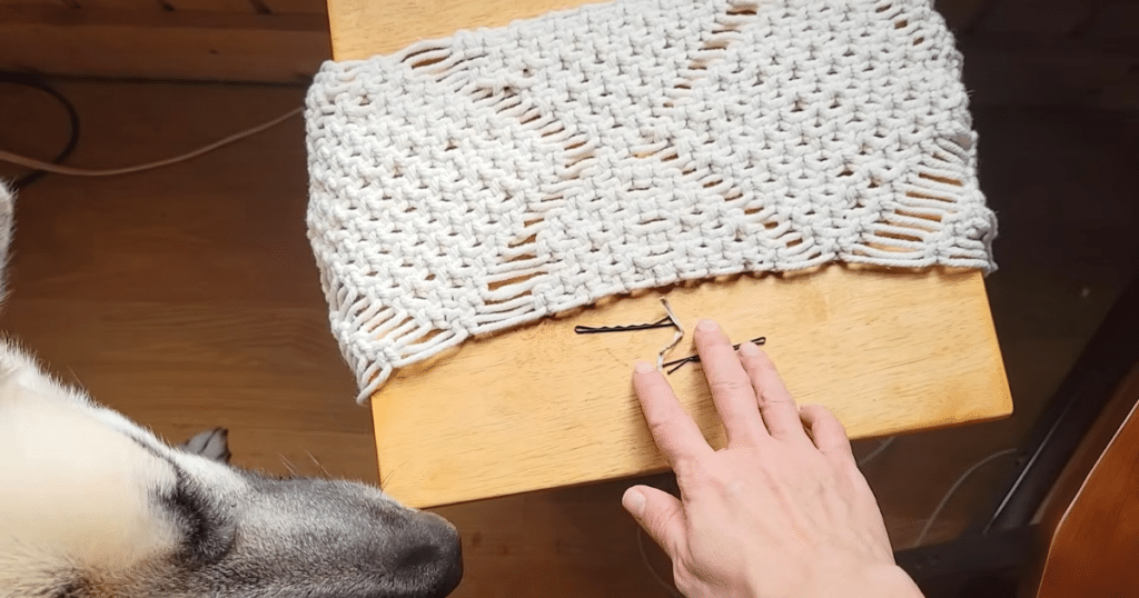 Dreame L50 Ultra Update bin objects | Vacuum Wars Loose bobby pins and pet hair on hardwood floor in a shedding dog household, illustrating debris that can tangle inside a robot vacuum dustbin.