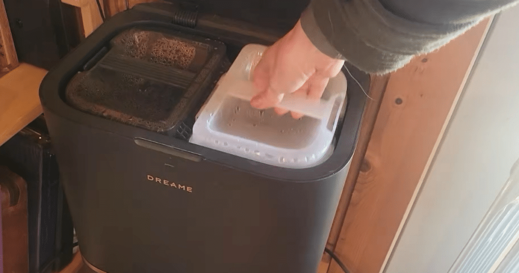 Dreame L50 Ultra Update water tanks | Vacuum Wars Refilling the Dreame L50 Ultra clean water tank at the dock station during routine maintenance.