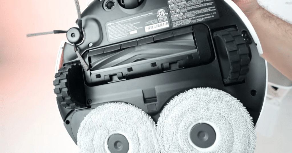 MOVA E40 Ultra V P10 Pro Ultra mop | Vacuum Wars Underside view of MOVA robot vacuum and mop hybrid showing dual spinning mop pads, main brush roller, and side brush design.