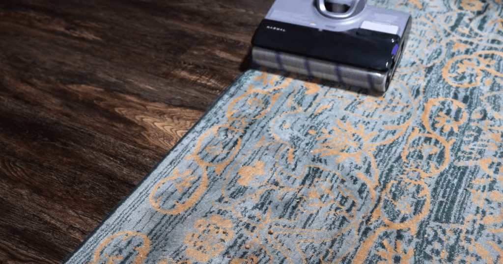 Narwal S20 pro rug | Vacuum Wars Narwal S20 Pro vacuum mop passing over a low-pile rug, demonstrating limited rug cleaning capability.