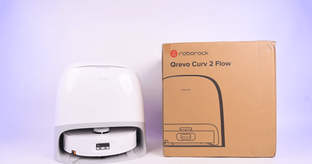 Roborock Qrevo Curv 2 Flow product | Vacuum Wars Roborock Qrevo Curv 2 Flow robot vacuum and base station next to retail box