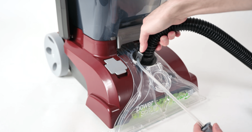 Attaching a hose | Vacuum Wars A carpet cleaner with a detachable hose that has to be installed and uninstalled with every use.