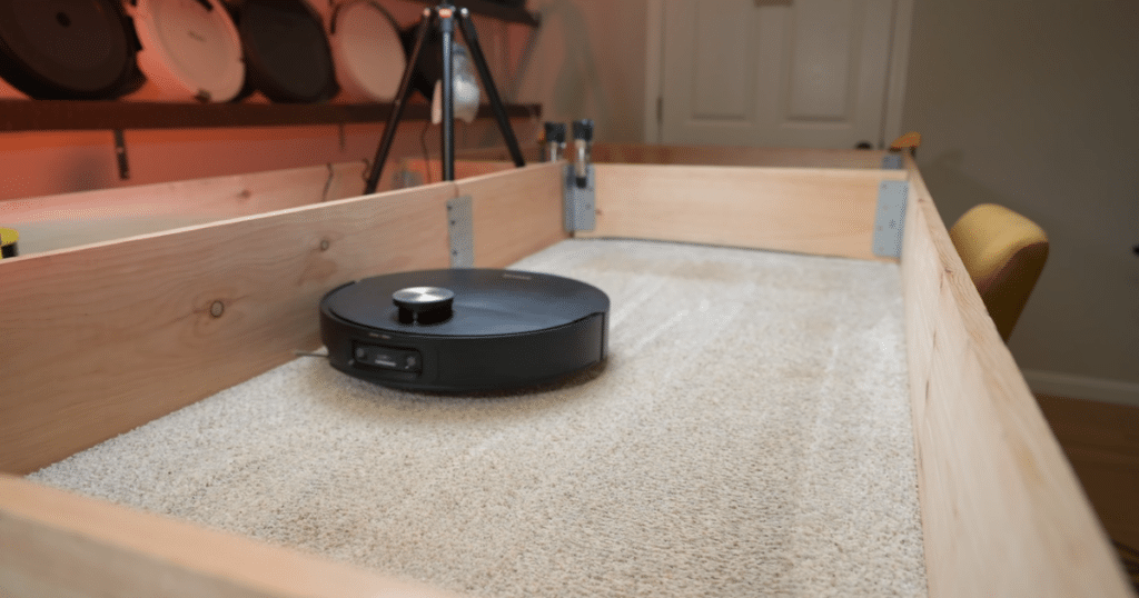 Dreame X60 Max Ultra Complete Carpet Deep Clean Test | Vacuum Wars Dreame X60 Max Ultra Complete performing a carpet deep-clean test with embedded sand in a controlled test enclosure