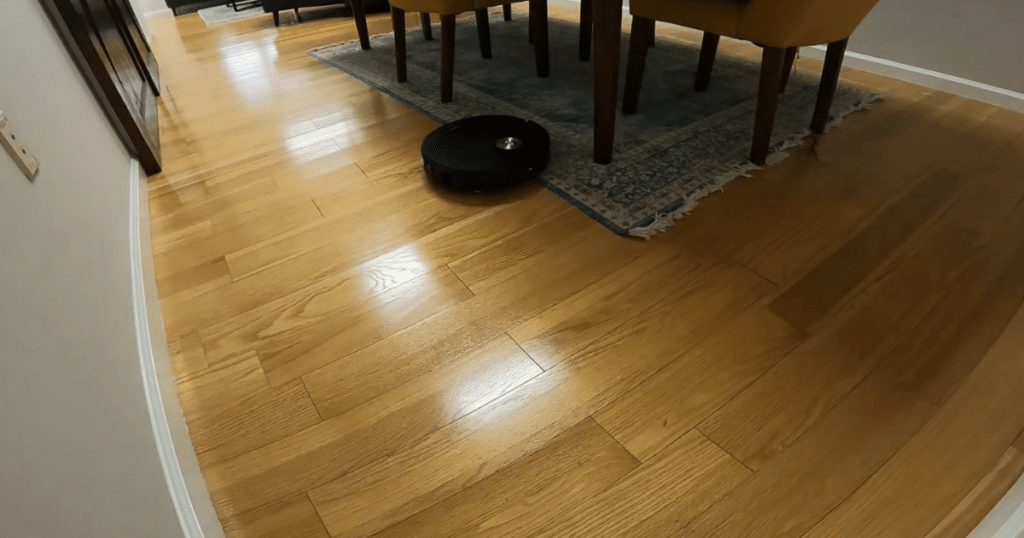 Dreame X60 Max Ultra Complete mixed floor | Vacuum Wars Dreame X60 Max Ultra Complete transitioning from hardwood floor to area rug with 21.5mm mop lift