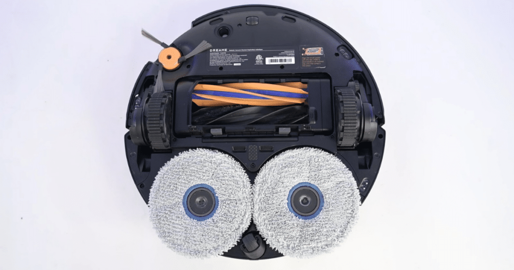 Dreame X60 Max Ultra Complete mop pads | Vacuum Wars Underside of Dreame X60 Max Ultra Complete showing dual spinning mop pads with heated water system and extending edge mop