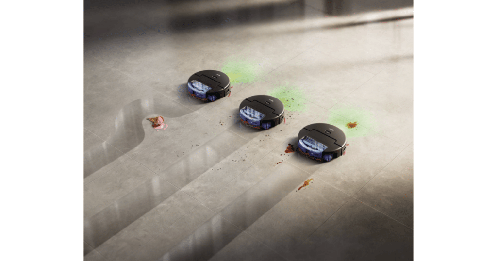 Dyson Spot and Scrub Adaptive Cleaning | Vacuum Wars Dyson Spot+Scrub AI robot vacuum navigating around debris on a hard floor using LiDAR and AI vision for obstacle detection.
