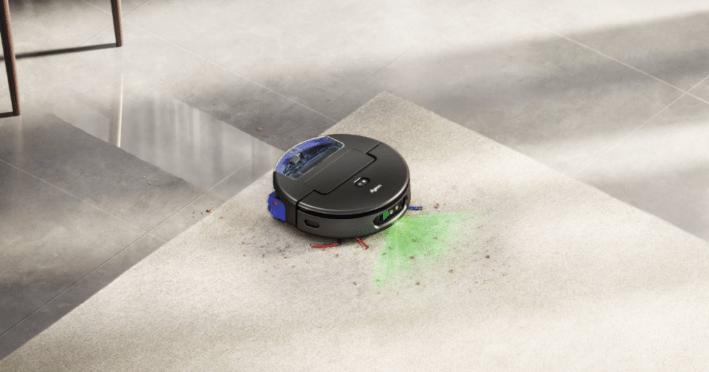 Dyson Spot and Scrub Carpet Detect | Vacuum Wars Dyson Spot+Scrub AI robot vacuum cleaning debris on carpet while using green illumination to detect dirt.