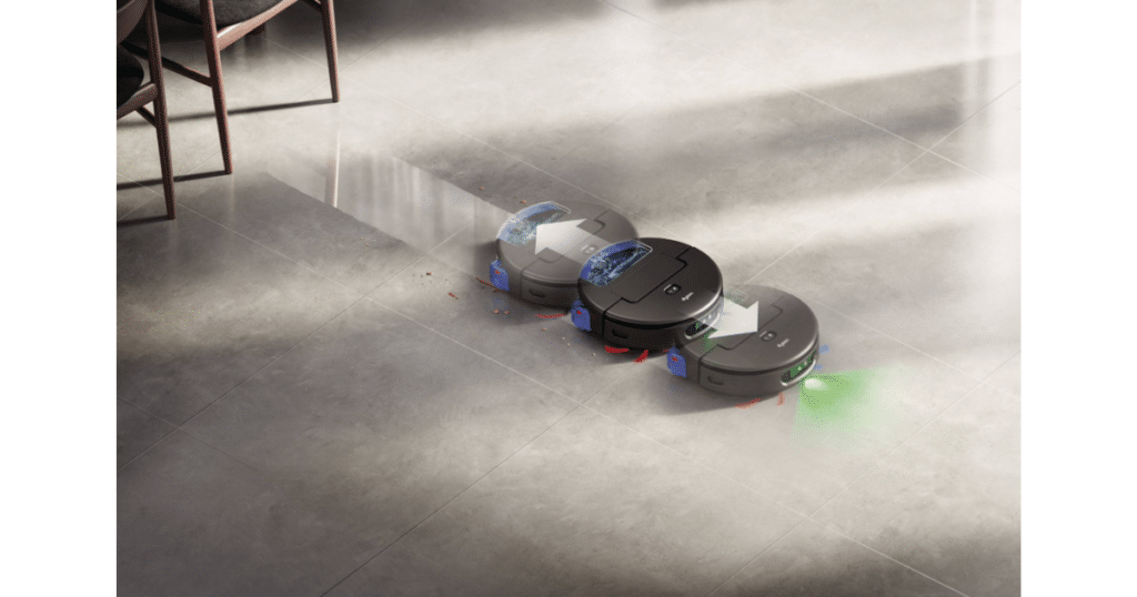 Dyson Spot and Scrub Multi Pass Cleaning | Vacuum Wars Dyson Spot+Scrub AI robot vacuum detecting a stain with green illumination and performing multiple cleaning passes on a hard floor.