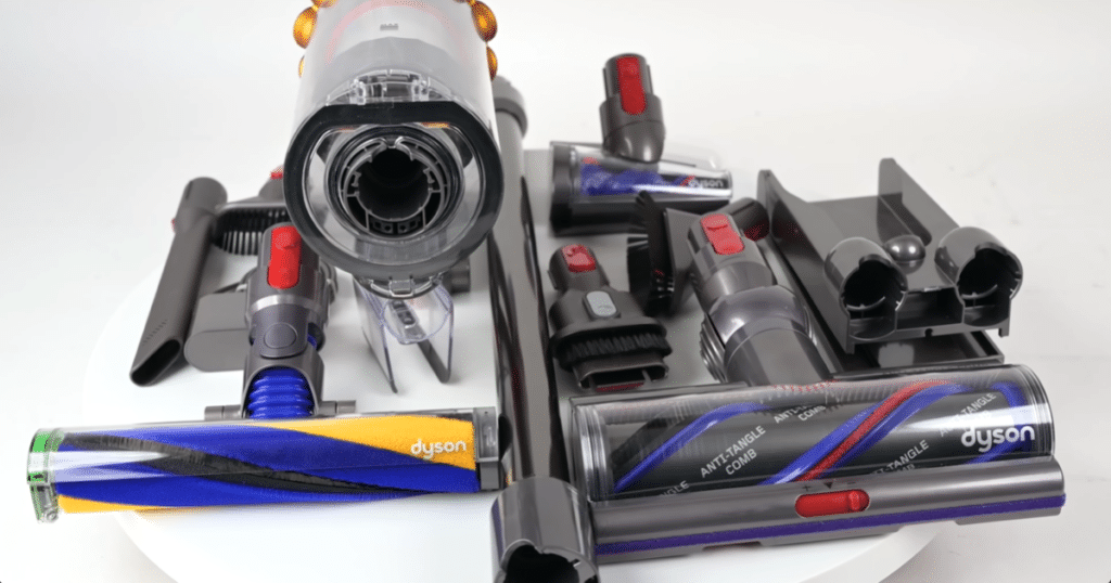 Dyson V15 Attachments | Vacuum Wars Dyson V15 Detect cordless vacuum with multiple attachments and cleaner heads arranged on a white surface