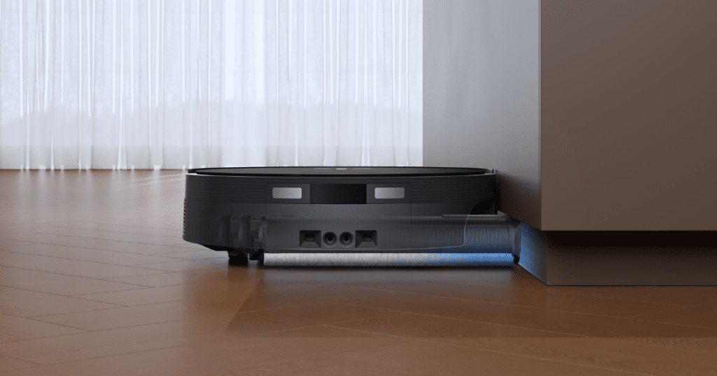 ECOVACS DEEBOT T90 PRO OMNI OZMO 30 | Vacuum Wars Close-up of ECOVACS DEEBOT T90 PRO OMNI robot vacuum cleaning floor edges with its microfiber roller mop system