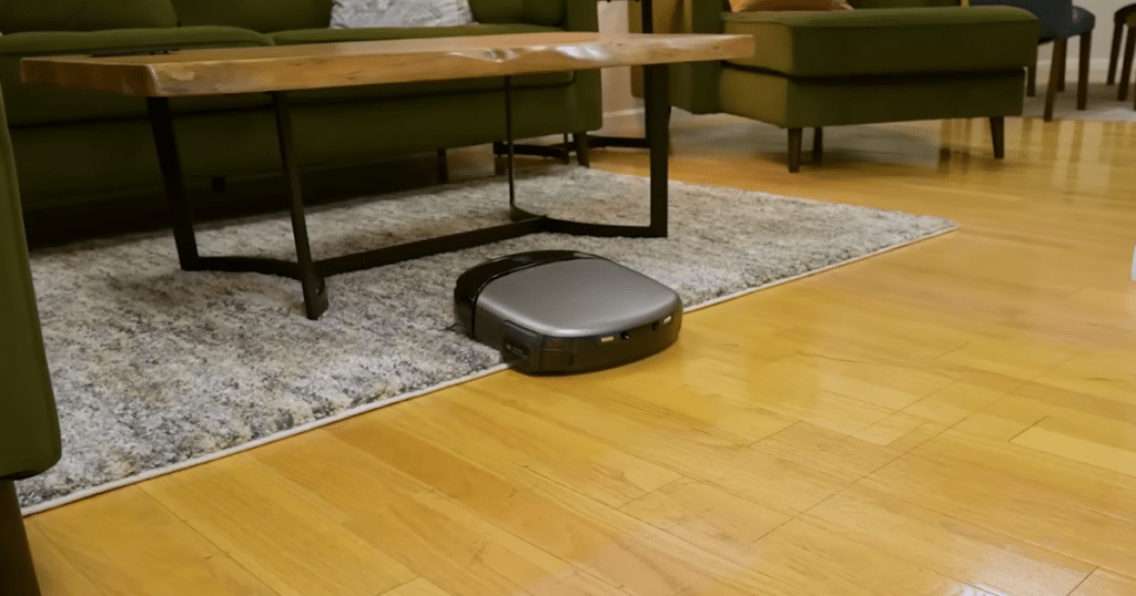 Eufy S2 v S1 Carpet lift | Vacuum Wars A robot vacuum transitioning from hard flooring onto a carpeted area, demonstrating how AI-enabled systems can detect floor types and adjust cleaning behavior automatically.