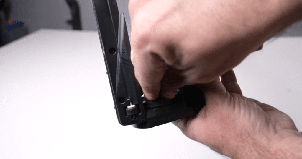 Levoit Aero tangle | Vacuum Wars Levoit Aero brush roll axle showing minor hair buildup requiring manual cleaning