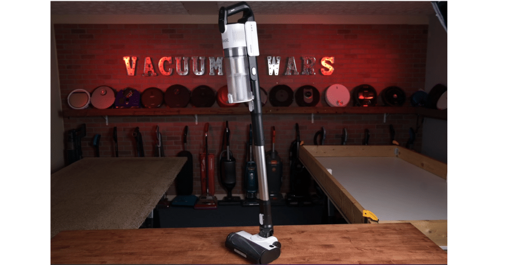 Levoit LVAC-200 Standing | Vacuum Wars Levoit LVAC-200 cordless vacuum standing upright on its own on a wooden surface