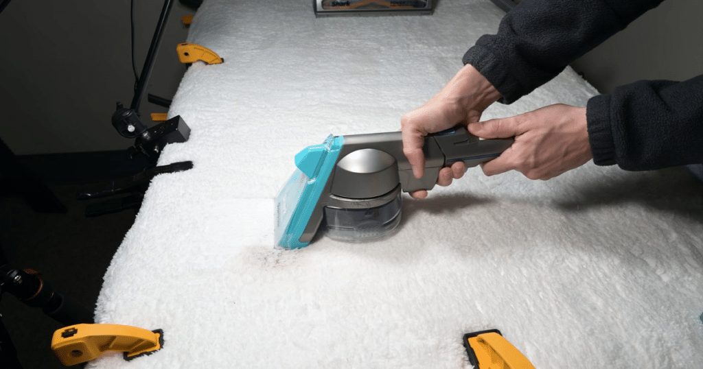 Shark CarpetXpert EX301 Specialized Attachment | Vacuum Wars Shark EX301 CarpetXpert pet mess extractor attachment being used on carpet to remove pet stains while containing debris in a separate chamber