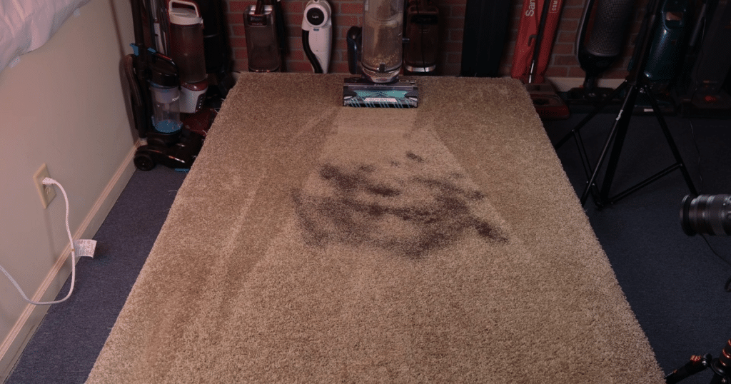 Shark PowerDetect Upright Carpet Pickup 1 | Vacuum Wars Shark PowerDetect Upright Vacuuming approaching fine debris on the surface of a carpet.