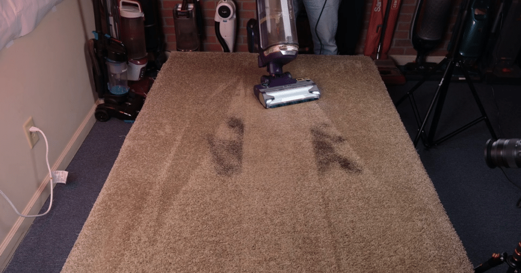 Shark PowerDetect Upright Carpet Pickup 2 | Vacuum Wars Shark PowerDetect Upright Vacuuming successfully vacuuming fine debris from the surface of a carpet.