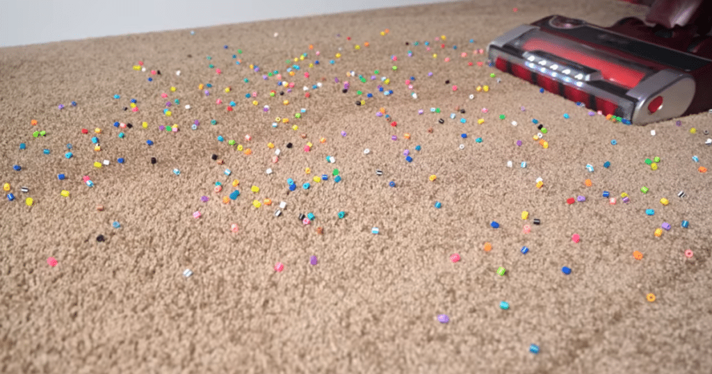 Shark Stratos Upright Vacuum Carpet Test1 | Vacuum Wars Shark PowerDetect Upright Vacuum approaching large debris on the surface of a carpet.