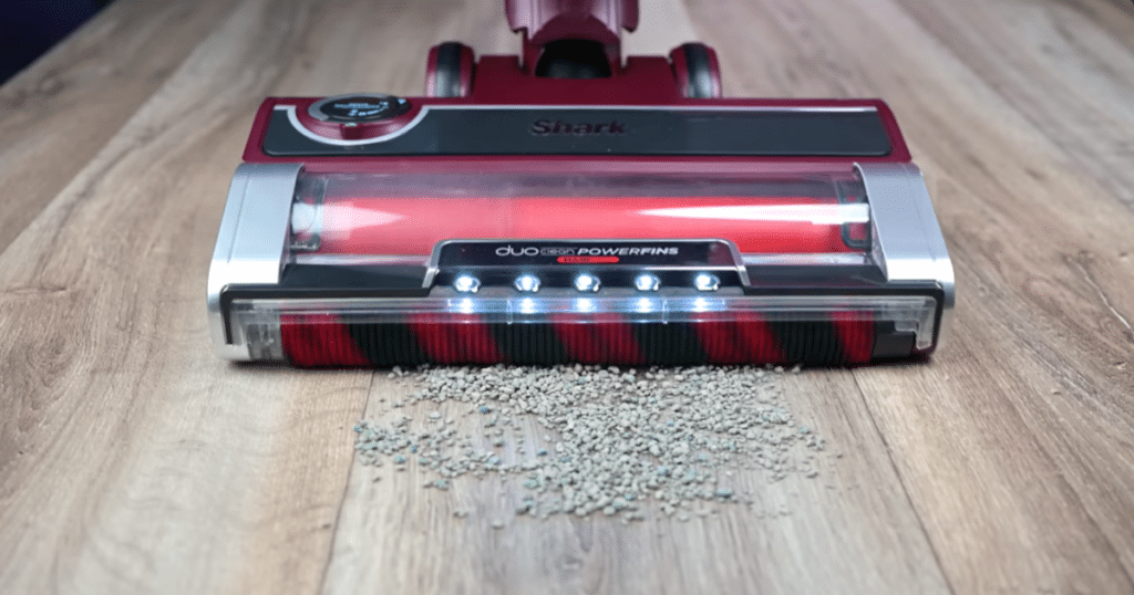 Shark Stratos Upright Vacuum Hard Floor Test1 | Vacuum Wars Shark Stratos Upright Vacuum approaching medium sized debris on the surface of a hard floor.