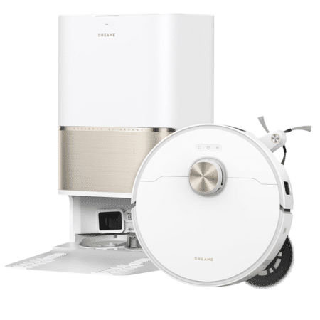 White Dreame robotic vacuum with its docking/charging station shown beside it, in a clean, modern setup.