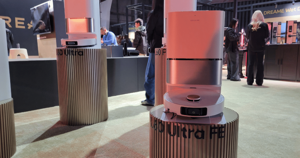 Dreame L60 Ultra FE robot vacuum with auto-empty dock displayed at Dreame Next event showing entry-level all-in-one design