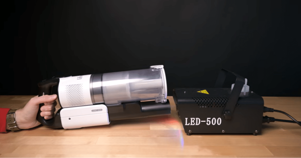 Levoit LVAC 200 filtration | Vacuum Wars Levoit LVAC-200 cordless vacuum shown during filtration testing with a particle visualization device.