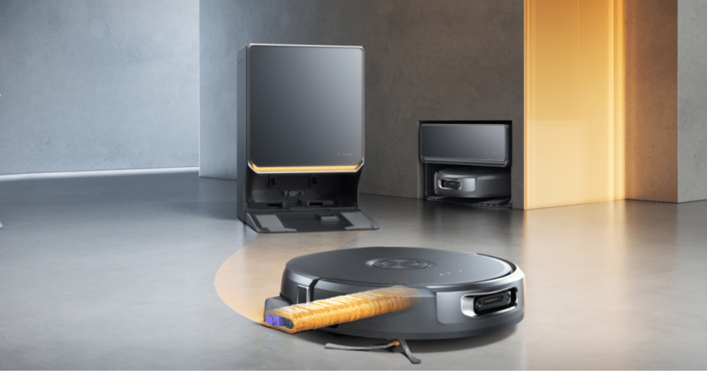 Narwal Flow 2 and docks | Vacuum Wars Narwal Flow 2 robot vacuum with extended rolling mop in front of its self-cleaning base station and plumbing integrated variant station