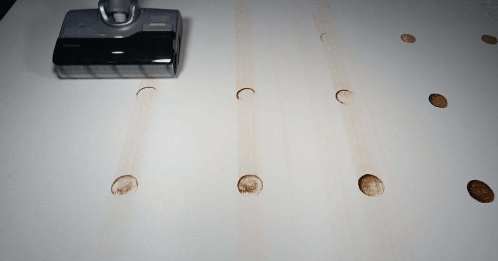 Narwal S20 Pro Stain Test 1 | Vacuum Wars The Narwal S20 Pro hard floor cleaner approaching stains on a hard floor.