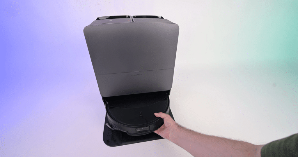 Roborock Saros 20 RockDock 1 | Vacuum Wars Roborock Saros 20 dock with robot being placed inside, showing hands-free maintenance system