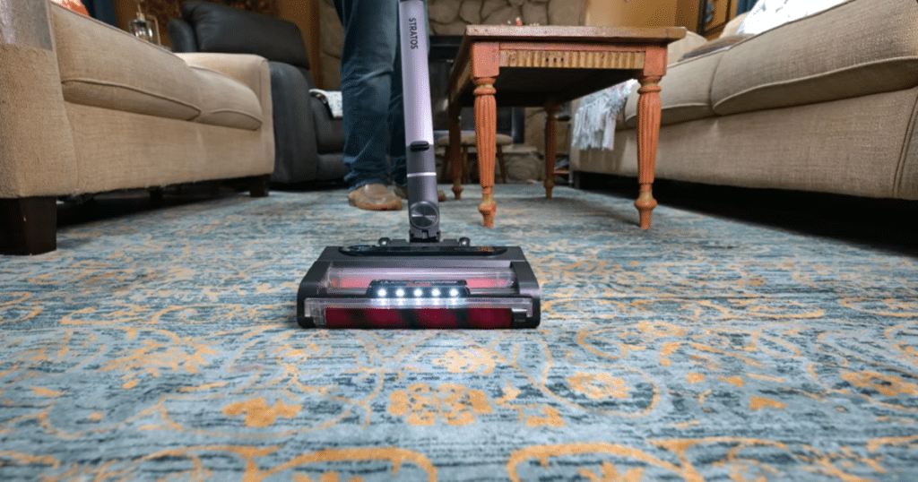 Shark Stratos Vacuuming Carpet | Vacuum Wars Shark Stratos cordless vacuum cleaning carpet in a living room, demonstrating brushroll performance and debris pickup.