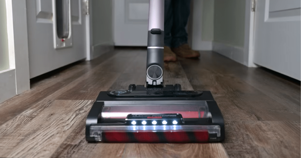 Shark Stratos Vacuuming Hard Floor | Vacuum Wars Shark Stratos cordless vacuum floorhead next to a stopwatch showing runtime during battery testing.