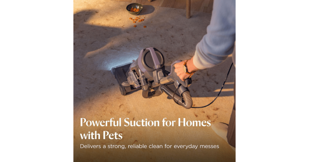 Bissell CleanView Max Allergen Pet Homes | Vacuum Wars Bissell CleanView Max Allergen upright vacuum cleaning pet mess on carpet with LED headlights illuminating debris