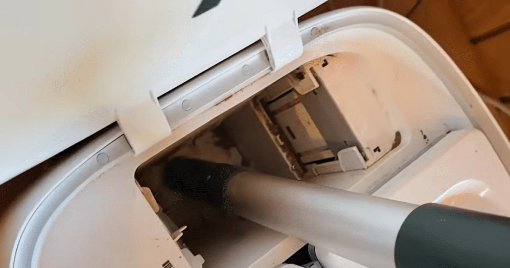 Roborock CurvX dustbin dust | Vacuum Wars Loose dust buildup inside Roborock Qrevo CurvX dock caused by low-quality third-party vacuum bags during testing