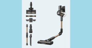 Cordless stick vacuum with a long wand and motorized floor head, plus attachments (crevice tool, brush, and mount)
