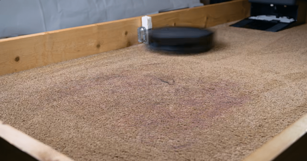 Ecovacs Deebot T90 Pro Omni Hair Tests 1 | Vacuum Wars The Ecovacs Deebot T90 robot Vacuum approaching the embedded pet hair on carpet test