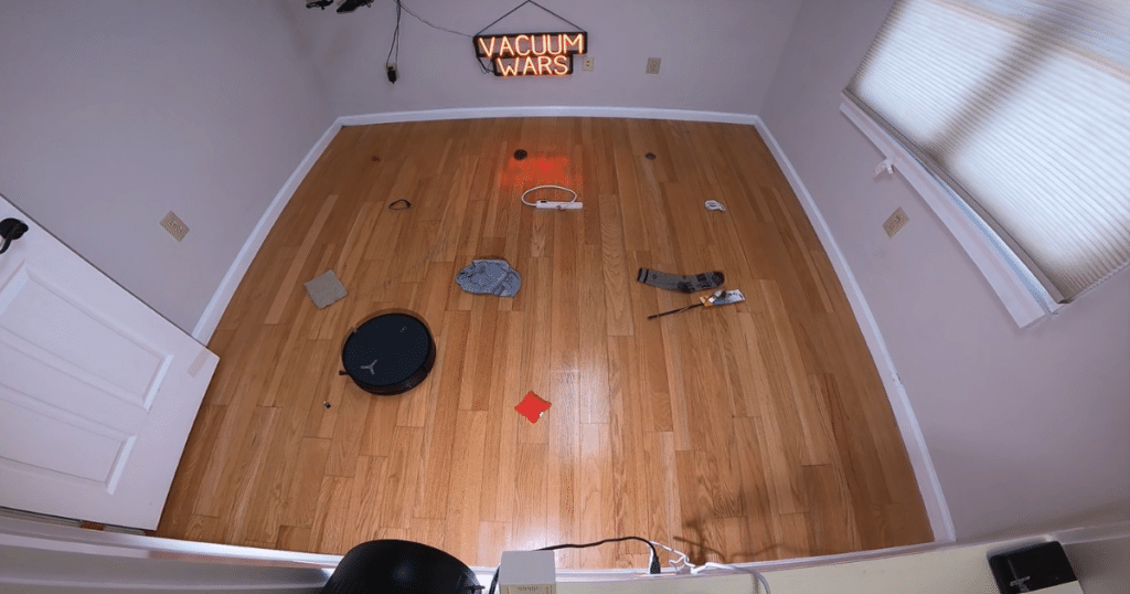 Ecovacs Deebot X12 OmniCyclone Obstacle Avoidance Assessment at Vacuum Wars | Vacuum Wars Ecovacs X12 OmniCyclone navigating around household objects during Vacuum Wars obstacle avoidance testing.