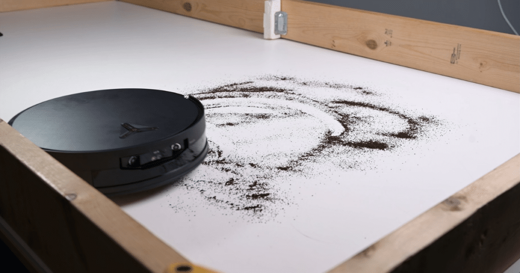 Ecovacs X12 OmniCyclone Hard Floor Fine Debris 1 | Vacuum Wars The Ecovacs X12 OmniCyclone approaching fine debris on a hard floor in our test environment