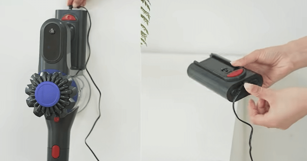 KARDV V06 battery detach | Vacuum Wars The KARDV V06 cordless vacuum mounted on its wall charging dock with a removable battery pack shown detached for separate charging and replacement.
